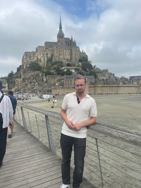 a photo of me in front of Le Mont Saint-Michel